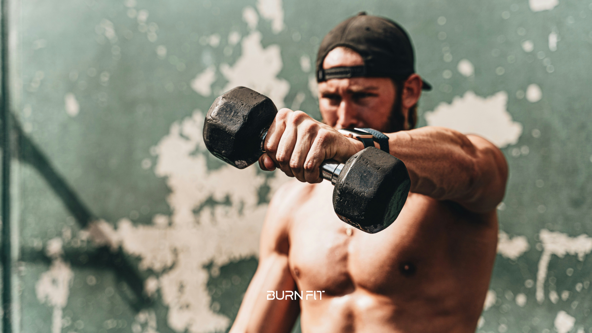 Man performing a dumbbell wrist curl exercise to build forearm muscles and grip strength. Fitness image highlighting forearm hypertrophy, wrist training, and upper body conditioning.