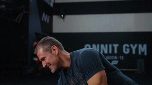 A humorous GIF of a man with a pillow trying to lie down and sleep on top of a kettlebell, serving as the main thumbnail for an article exploring how to sleep better through targeted exercise.