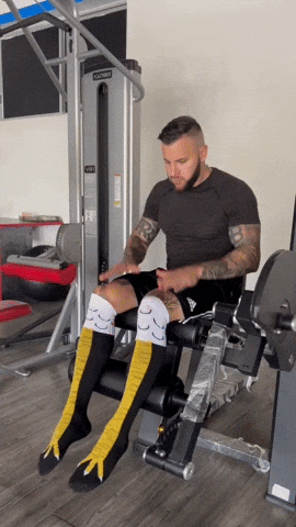 A dynamic GIF image of a man performing the leg extension machine with controlled technique to isolate his quadriceps, serving as the main thumbnail visual for a guide detailing 3 essential form tips to master the leg extension.